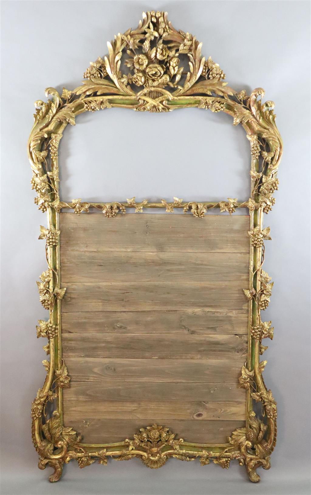 A 19th century giltwood overmantel mirror frame, width 4ft 1in. height 7ft 8in.